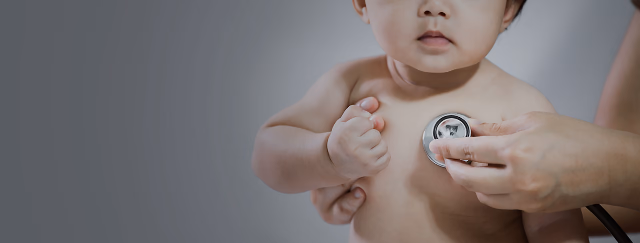 A paediatrician with a young patient